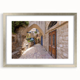 Textured abstract art print of Jerusalem in muted earth tones on a framed canvas, suited for bedroom decor.