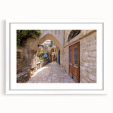 Abstract art print of Jerusalem skyline in muted earth tones on a framed white mat, suitable for dining room decor.