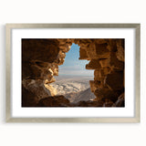 Textured abstract art print depicting a Middle Eastern landscape in muted earth tones, framed with a silver mat.