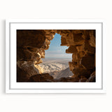 Abstract art print of Middle Eastern scenery in muted earth tones, framed with a white mat, ideal for dining room decor.