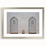 Textured abstract art print depicting a Middle Eastern desert scene in muted earth tones on a framed silver mat.