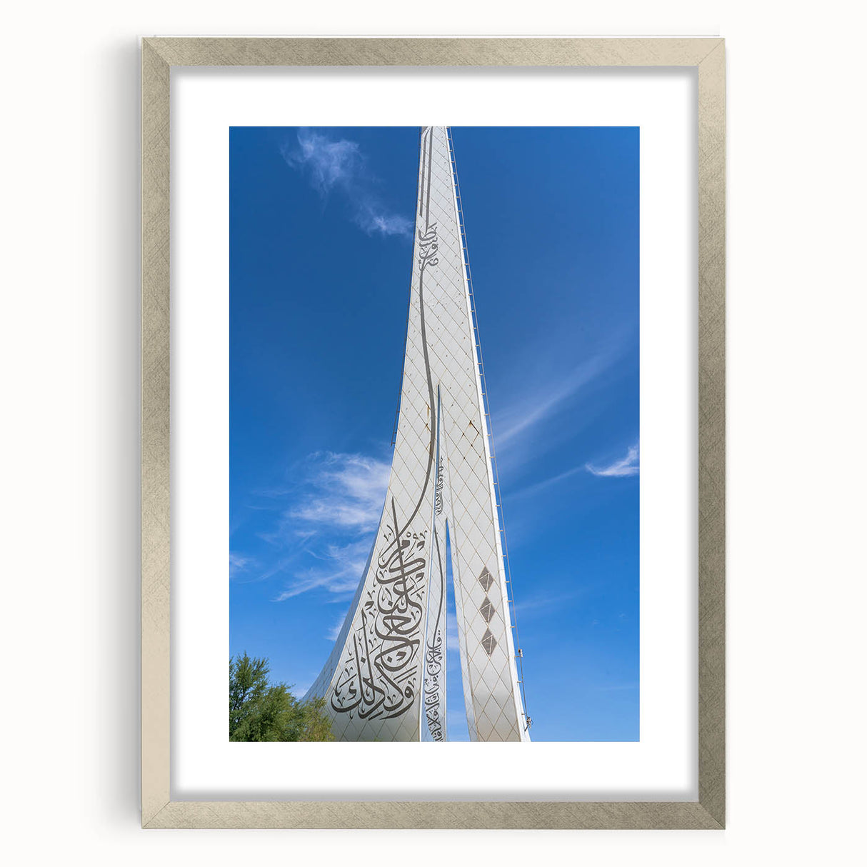 Textured abstract art print of Qatar scenery in muted earth tones, framed in silver, ideal for bedroom art.