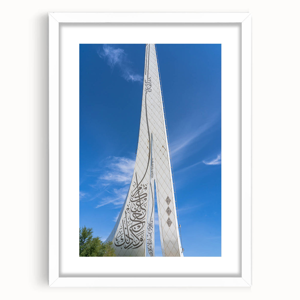 Abstract art print of a Qatar scenery in muted earth tones on a white matted frame, suitable for dining room decor.