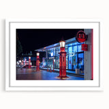 Abstract art print of Auckland skyline in muted blue and gray, framed in white, suitable for dining room decor.