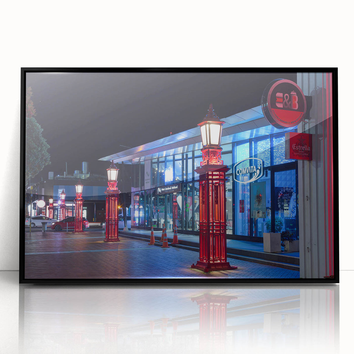 Large abstract wall art depicting Auckland's skyline in muted gray and blue tones on a framed acrylic print.