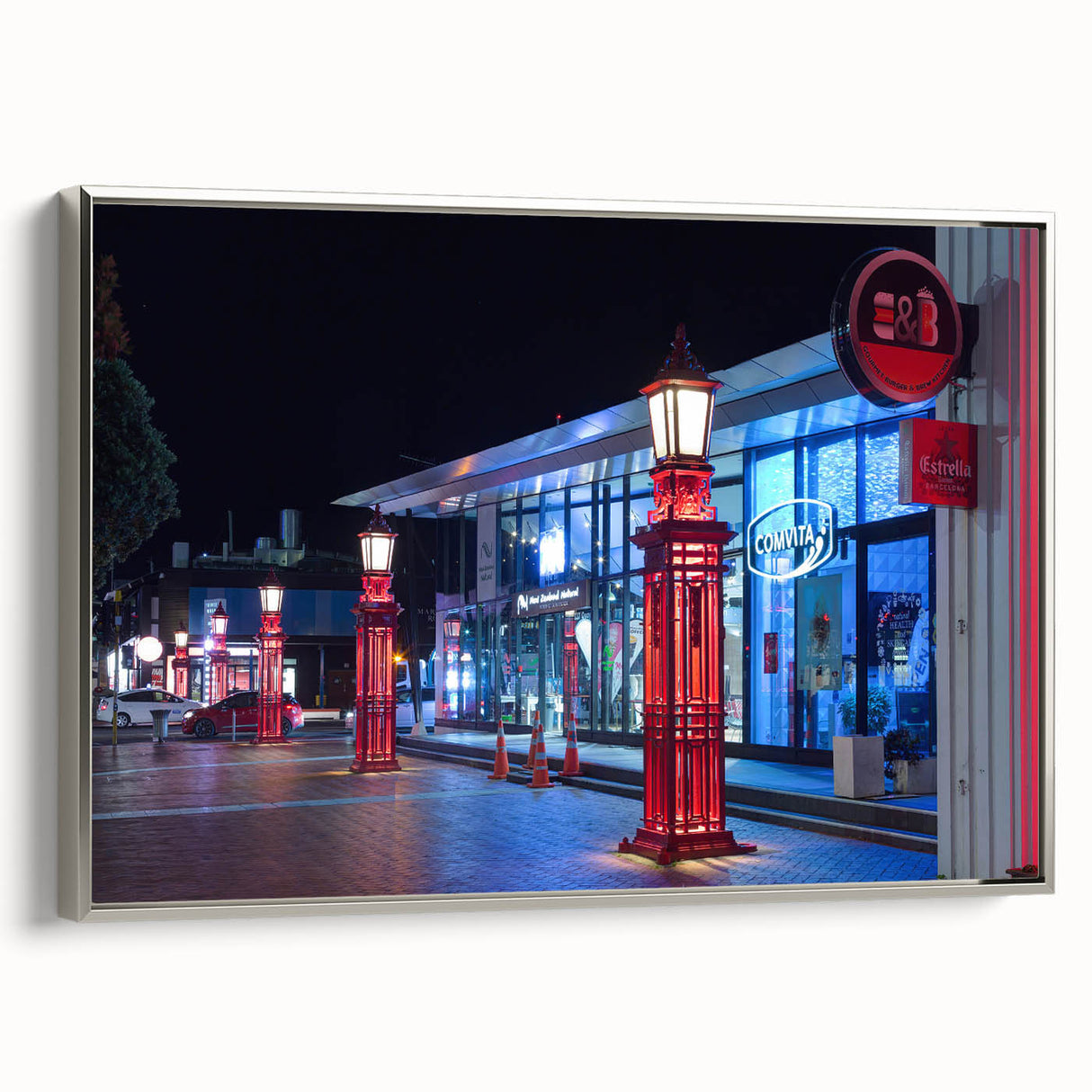 Landscape art painting of Auckland, featuring vibrant colors on a silver-framed canvas, ideal for living room decor.
