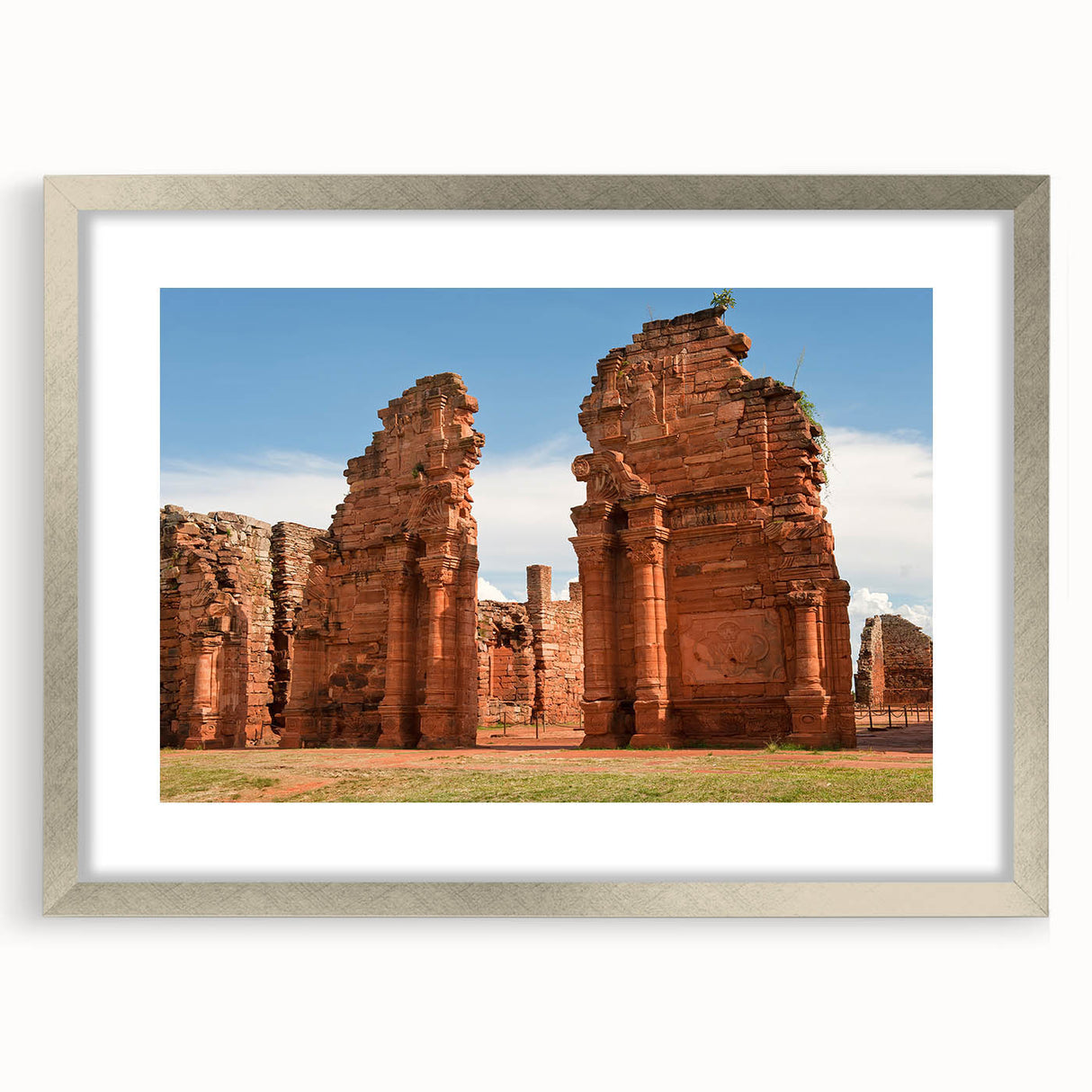 Textured abstract art print depicting a muted blue and gray Argentine landscape, framed in silver, ideal for bedroom art.