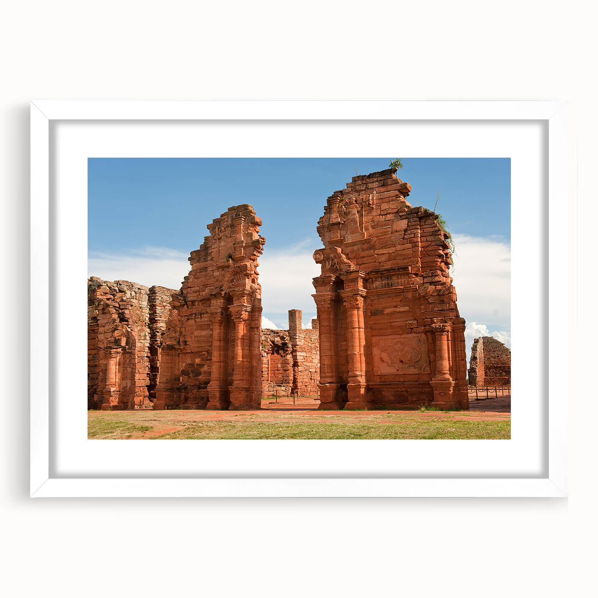Abstract art print depicting a scenic view of Argentina with vibrant earth tones on a framed white mat.