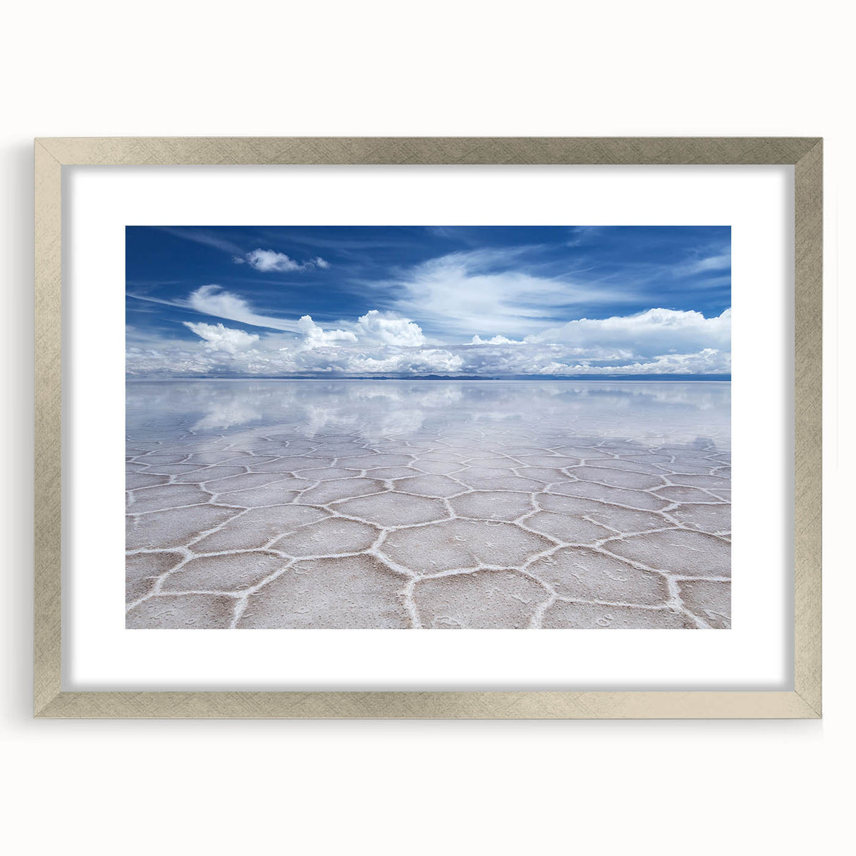 Textured abstract art print depicting a Bolivian landscape, in muted earth tones, framed in silver, suitable for bedroom art.
