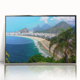 Mid-century modernist art depicting a stylized Brazilian landscape in muted green and blue tones, framed in silver acrylic.