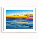 Abstract art print of San Diego with vibrant blue and orange hues, framed in white, ideal for dining room decor.