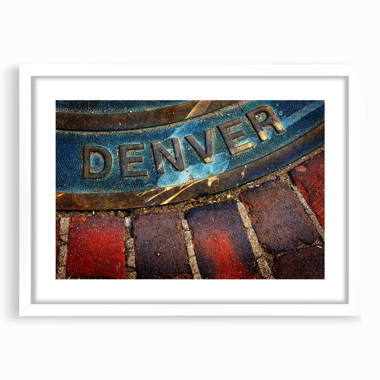 Abstract art print of Denver skyline in muted gray and blue tones on a framed white mat, ideal for dining room decor.
