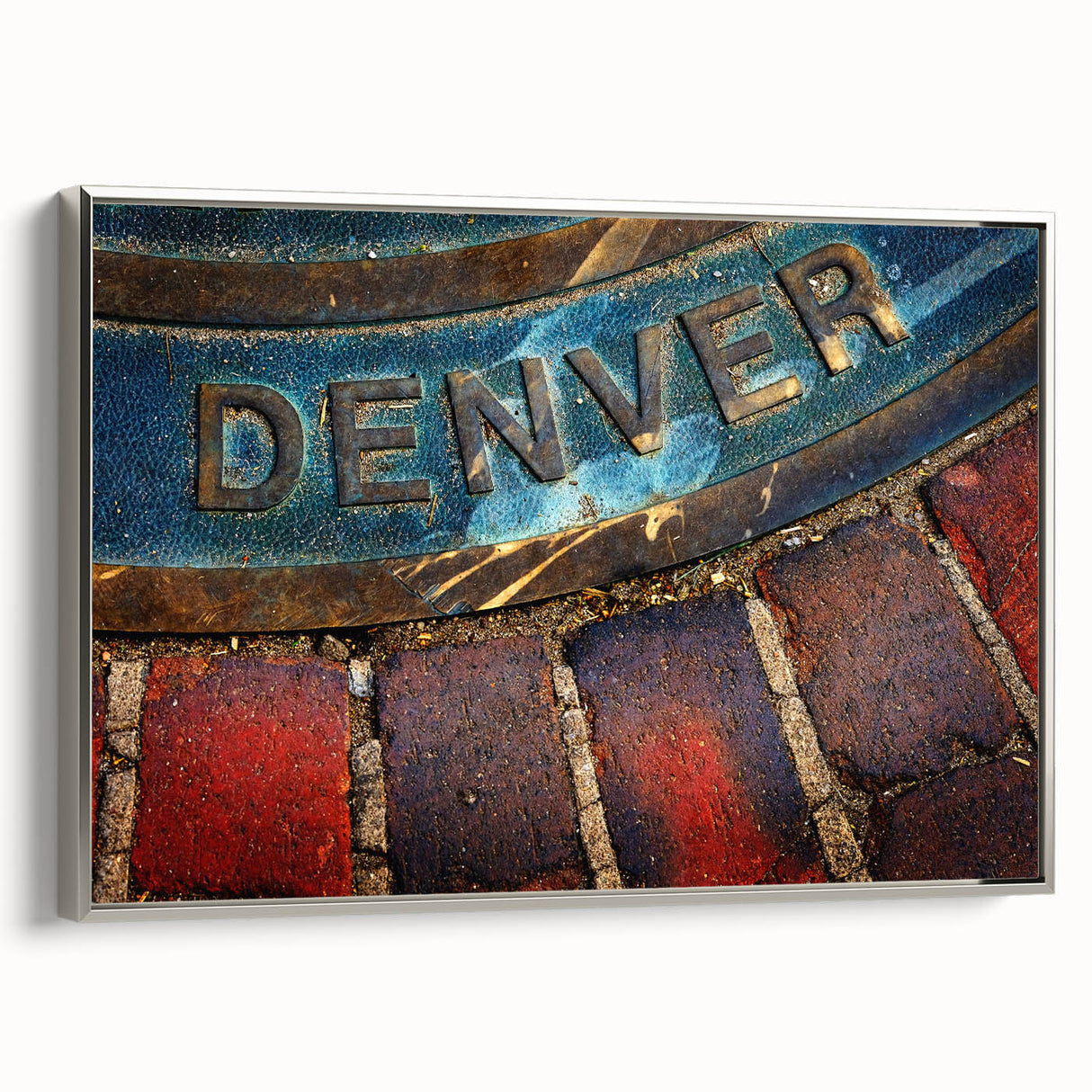 Framed canvas depicting a vintage-style landscape painting of Denver, Colorado, in vibrant colors on a black background.