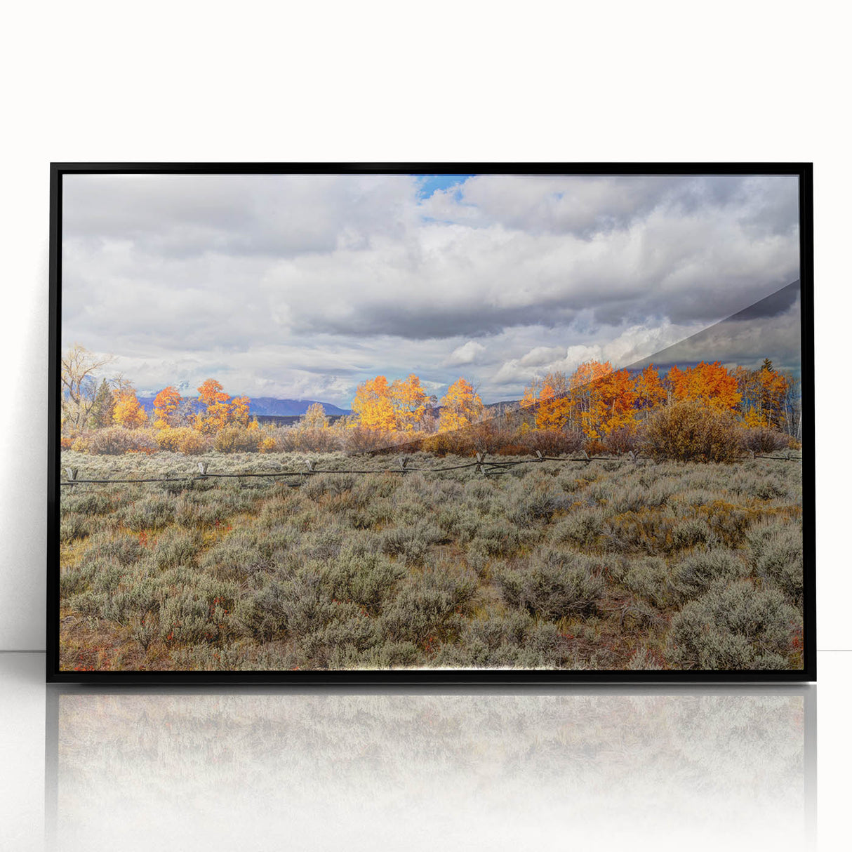 Large abstract wall art featuring a stylized Idaho landscape in muted earth tones, framed in black acrylic.