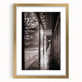 Abstract art print of a New Orleans scenery in gold frame with mat, featuring textured blue and gray tones.