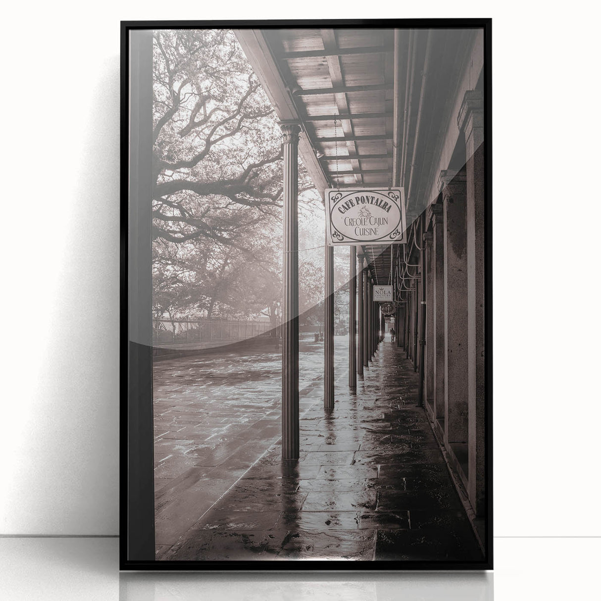 Large abstract wall art depicting a stylized New Orleans scene in muted earth tones, framed in black acrylic.