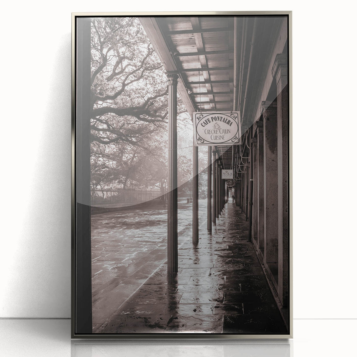 Mid-century modernist art depicting a New Orleans street scene in muted earth tones on a silver-framed acrylic print.