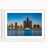 Abstract art print of Detroit skyline in muted blue and gray tones on a framed white mat, ideal for modern dining room decor.