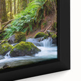 Black wall art featuring a textured, colorful depiction of the Olympic landscape on a framed canvas.