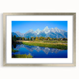 Textured art print of the Grand Tetons in muted earth tones, framed in silver, ideal for bedroom art.