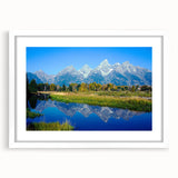 Abstract art print of Wyoming's Grand Tetons in muted earth tones on a white framed mat, suitable for dining room decor.