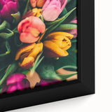 Close-up of a large framed canvas featuring black textured art with colorful, abstract spring motifs.