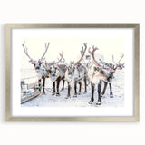 Textured art depicting an abstract winter scene in muted blue and white tones on a framed silver mat.