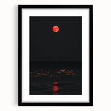 Abstract art print featuring textured, colorful autumn leaves on a large canvas, framed in black.