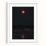 Abstract art print depicting autumnal trees in orange and red tones on a white framed canvas.