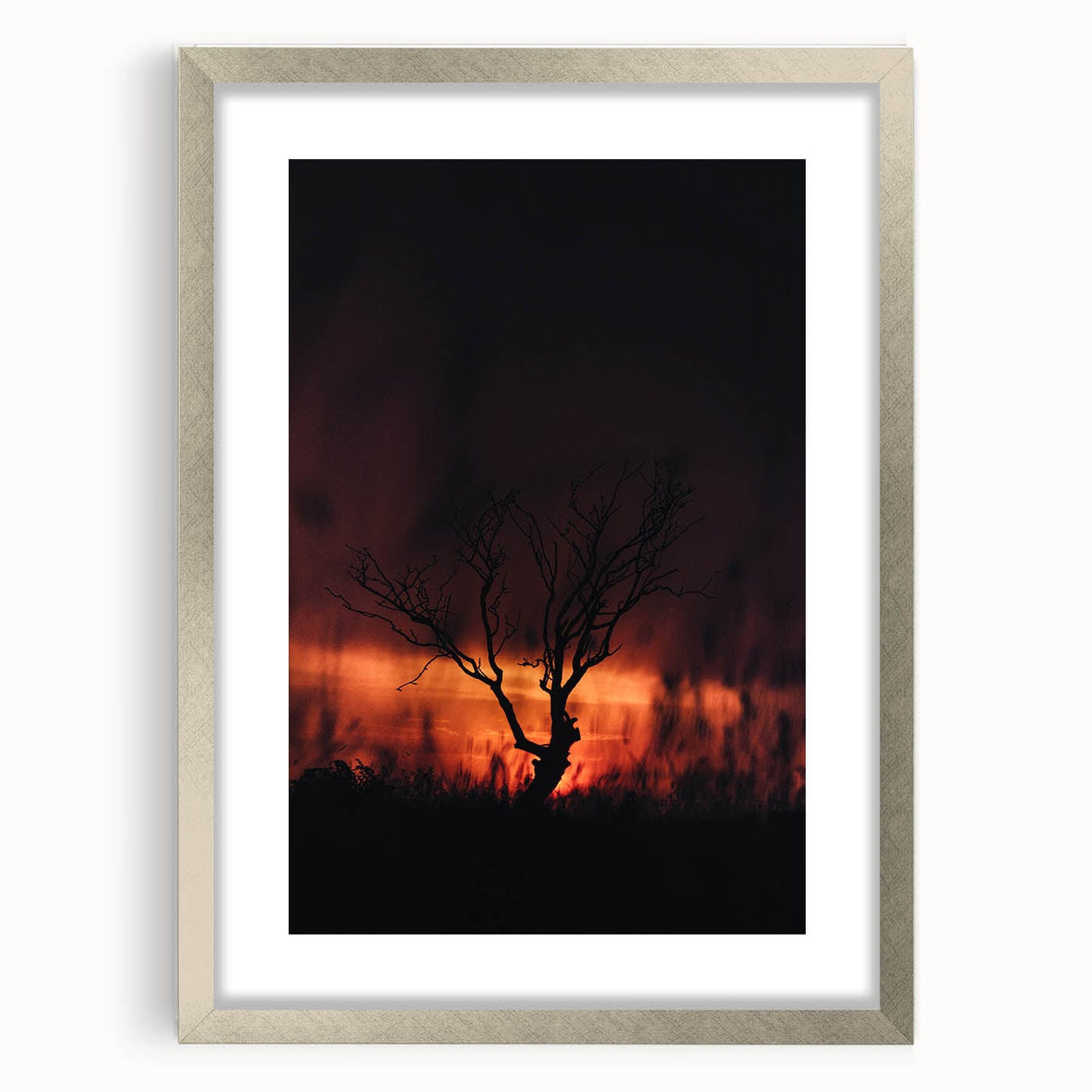 Textured abstract art print with rich orange and brown hues on a silver-framed canvas, suitable for bedroom decor.