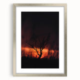 Textured abstract art print with rich orange and brown hues on a silver-framed canvas, suitable for bedroom decor.