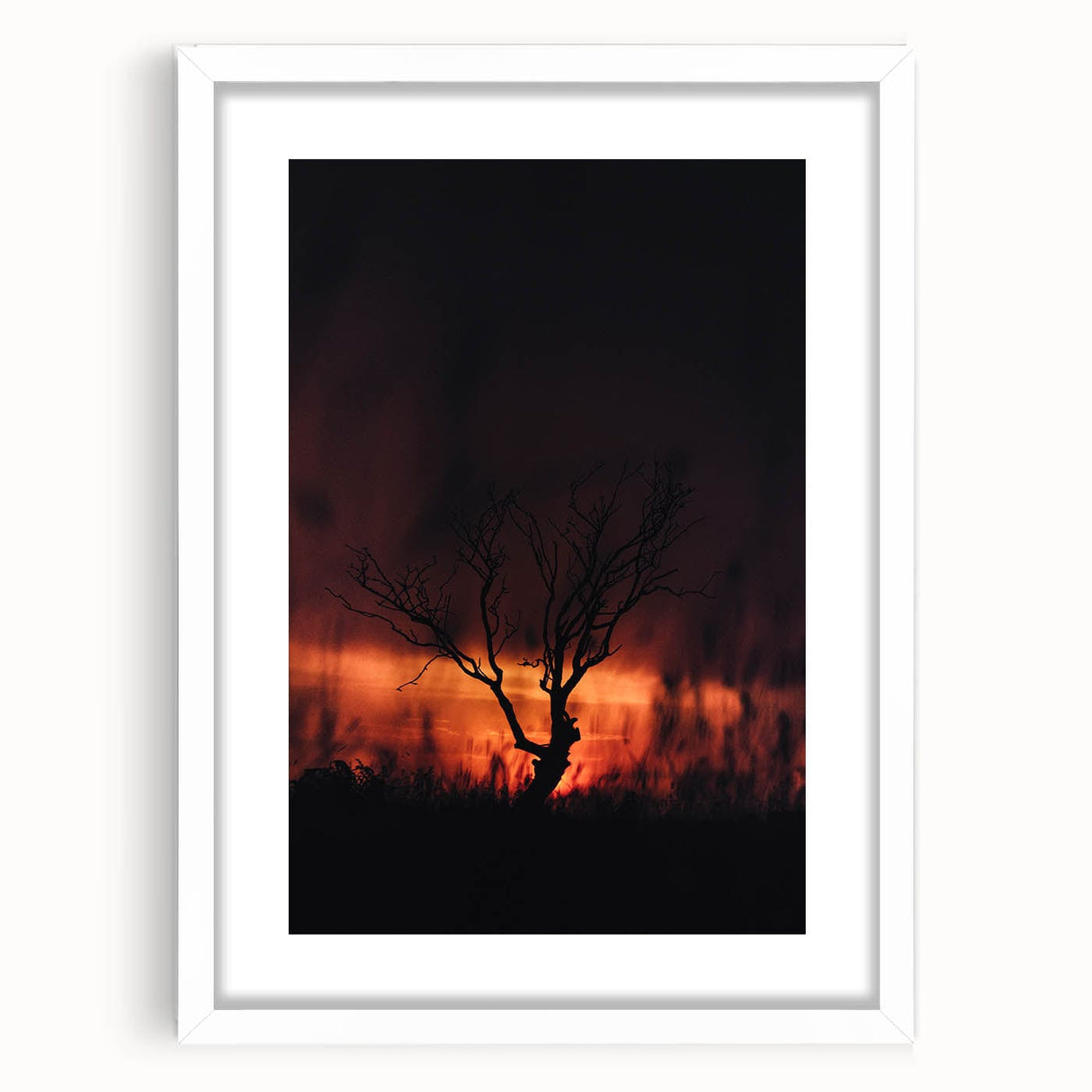 Abstract art print depicting autumnal colors on a white framed canvas, suitable for bedroom or dining room decor.