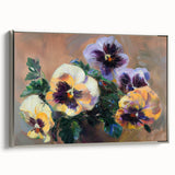 Framed canvas showcasing an abstract floral design in vibrant colors, elegantly bordered with a sleek silver frame, perfect for modern home decor.