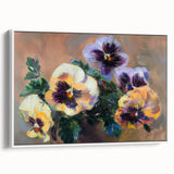 Framed canvas artwork showcasing an abstract floral design in vibrant colors, displayed in a white frame, emphasizing modern home decor aesthetics.