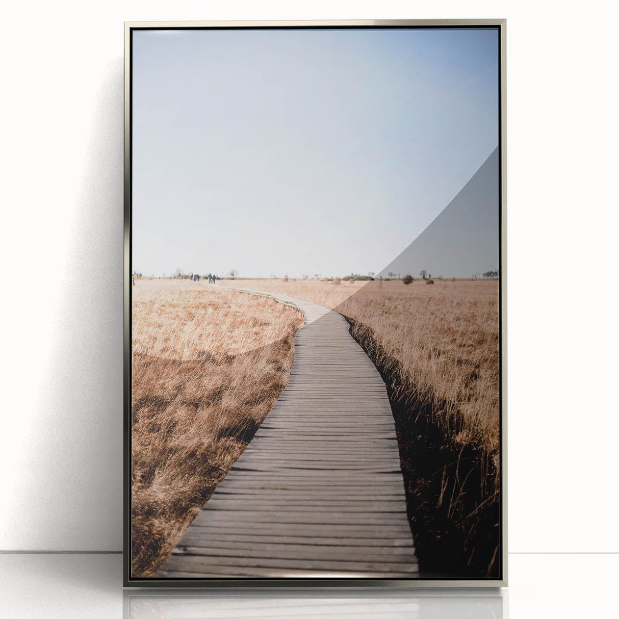 Mid-century modernist art depicting fall foliage in vibrant orange and yellow on a silver framed acrylic.