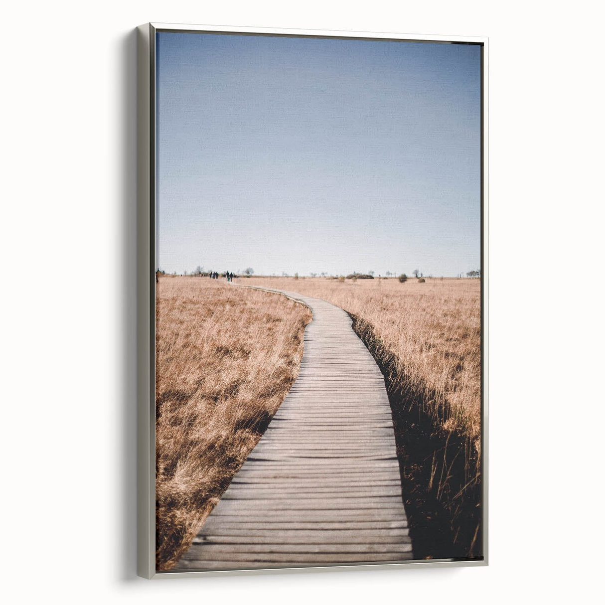 Framed canvas featuring a vintage landscape painting of autumn trees in vibrant red and orange hues.