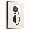 Framed abstract minimalist wall art design showcasing bold black shapes on a white canvas, displayed in a sleek, modern frame with a side view perspective.