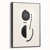 Framed abstract minimalist wall art design showcasing bold black shapes on a white canvas, displayed in a sleek, modern frame with a side view perspective.