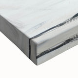 Close-up of a large art canvas featuring a black and white landscape painting of fruit, ideal for bedroom wall decor.