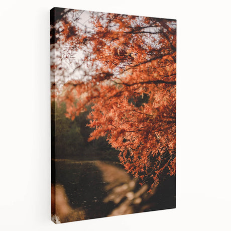 Side view of a large stretched canvas featuring a fall-themed abstract design in warm orange and red tones.