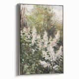 Framed canvas showcasing an abstract floral design in vibrant colors, accented with a sleek silver frame, ideal for modern home decor. Perfect for adding a touch of elegance to any room.