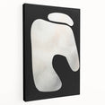 Abstract minimalist wall art design on stretched canvas showcasing bold shapes and muted colors, viewed from the side to highlight its depth and texture. Perfect for modern home decor.
