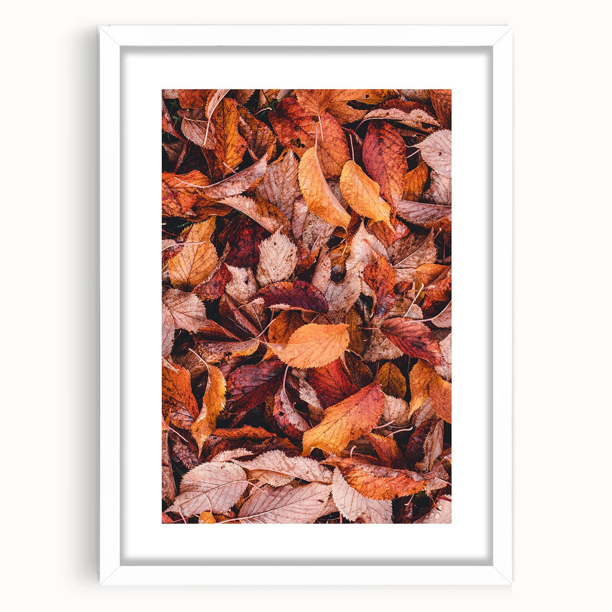 Abstract art print featuring swirling autumnal hues on a white framed canvas, suitable for dining room or bedroom decor.