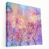 Abstract floral canvas art featuring vibrant shades of blue, pink, and green, elegantly stretched over a frame, showcasing a modern aesthetic perfect for contemporary home decor.