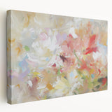 Abstract floral stretched canvas artwork showcasing vibrant colors like blue, pink, and yellow, elegantly displayed from the side to highlight its depth and texture.