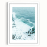 Abstract art print featuring swirling blue and green patterns on a white framed canvas.