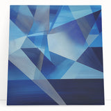 Abstract geometric stretched canvas artwork featuring vibrant colors and intricate patterns, leaning against a modern wall, perfect for contemporary home decor.