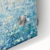 Close-up of vibrant abstract acrylic splatters on glass, showcasing a colorful and dynamic design with shades of blue, pink, and yellow, ideal for modern decor.