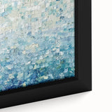 Abstract canvas artwork showcasing vibrant splatters of blue, orange, and yellow hues, framed elegantly, perfect for modern home decor. The close-up highlights the intricate textures and dynamic colors, enhancing any artistic space.