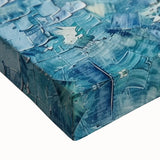 Close-up of a vibrant abstract splatter design on stretched canvas, showcasing bold colors and dynamic patterns ideal for modern home decor or art enthusiasts.